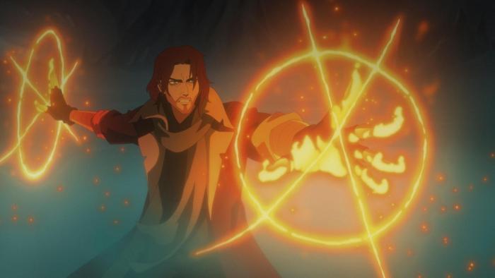 The Mighty Nein: Caleb frowns as a he casts a spell that emits circles of fire and light from his hands.