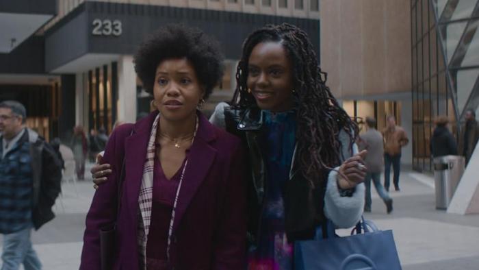 The Other Black Girl TV show screenshot 3: Ashleigh Murray smiles as she puts her arm around Sinclair Murray. 