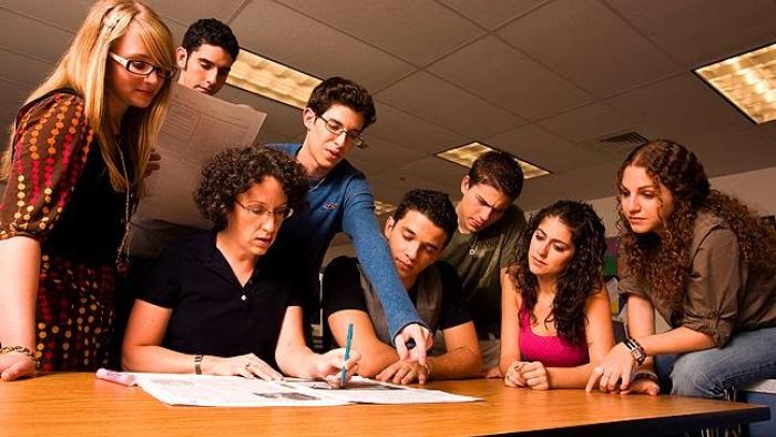 The Paper TV show screenshot: the staff of the paper gathers around their instructor
