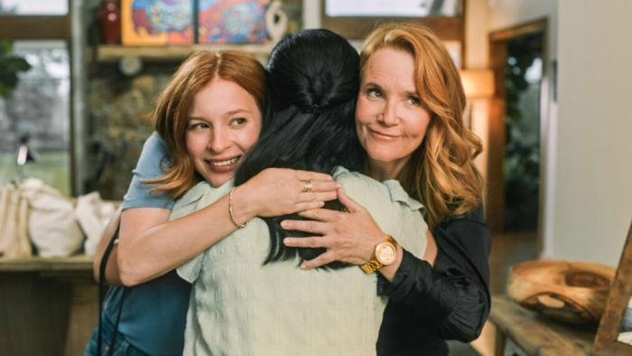 The Spencer Sisters TV show screenshot: A mother and daughter are shown hugging a woman together.