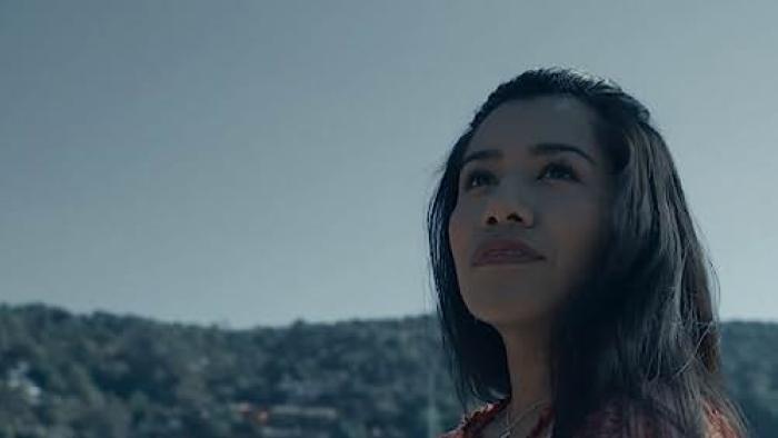 The Surrogacy TV show screenshot 1: Shani Lozano as Yeni stares up into the sky.