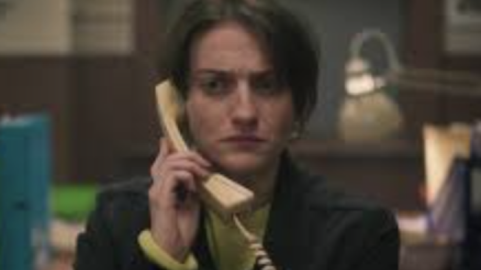 The Vanishing Triangle screenshot 3: Lisa Wallace on yellow phone looking upset. 