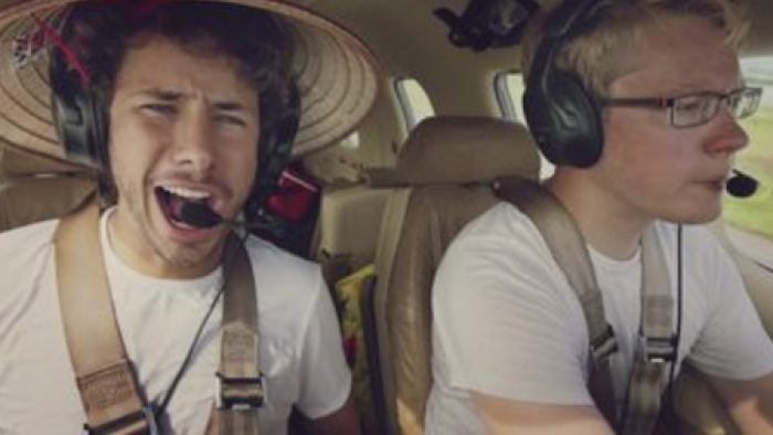The Worst Trip Around the World TV show screenshot 1: Juanpa Zurita sitting in airborne plane next to Matt Guthmiller.
