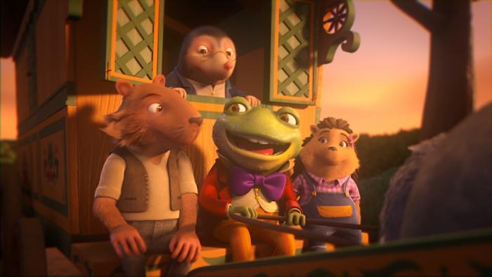 Toad & Friends TV screenshot 1: Toad talks as he drives a carriage sitting between friends Ratty and Hedge. Mole listens from the passenger cabin.