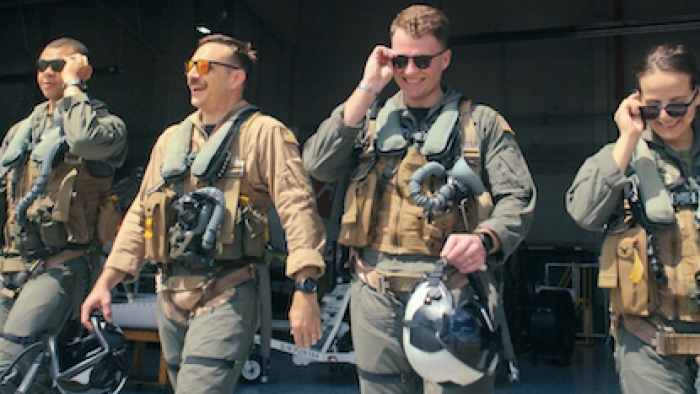Top Guns: The Next Generation TV show screenshot 1: Four student pilots walk out into the sunshine in military uniform.