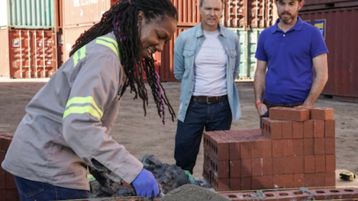 Tough as Nails TV Show: A contestant quickly lays brick and mortar