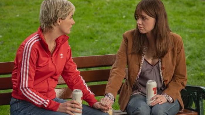 Toxic Town TV show screenshot 1: new mothers Susan and Tracey bond on a park bench