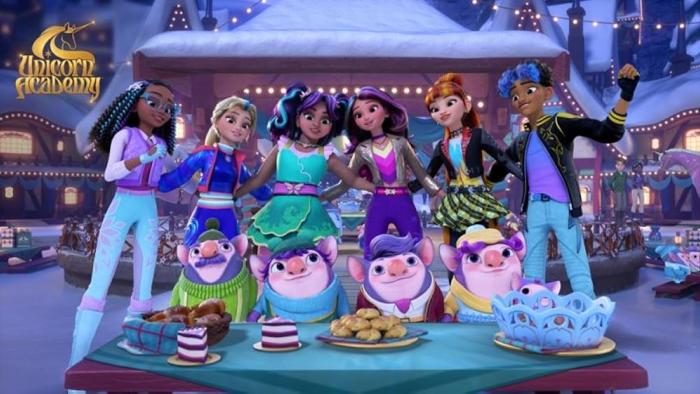 Unicorn Academy Winter Solstice TV show screenshot: Friends Layla, Isabel, Ava, Sophia, Valentina and Rory embrace, while dwerpins feast