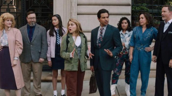 Up Here TV show:  Lindsay and Miguel stand together in the center of the picture, surrounded by actors portraying their inner voices, three men ad women for both characters