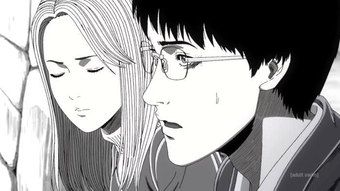 Uzumaki TV show screenshot 1: Kirie and Suichi look concerned as they talk while walking home.