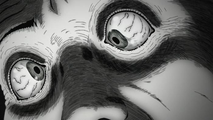 Uzumaki TV show screenshot 4: Close-up of a man's blood-shot eyes with pupils facing in different directions.
