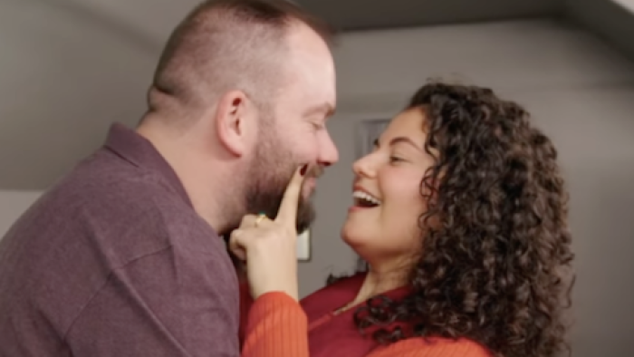 Virgins TV show screenshot 1: Alexander Stunz gets stopped by woman when leaning in to her. 