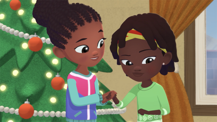 Weather Hunters Christmas in Africa TV Show: Corky and Binta chat in front of the Christmas tree