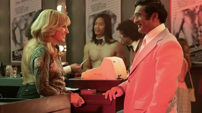 Welcome to Chippendales TV show: Kumail Nanjiani talks to a blonde woman working at a Chippendales