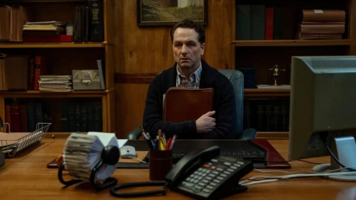 Widow's Bay TV show screenshot 1: the mayor (Matthew Rhys) sits at his desk