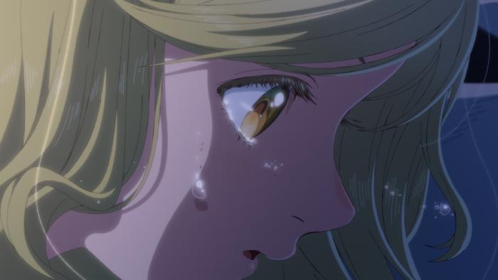 Witch Hat Atelier TV show screenshot 3: A close-up of Coco's face shows her crying in the dark but looking surprised rather than sad.