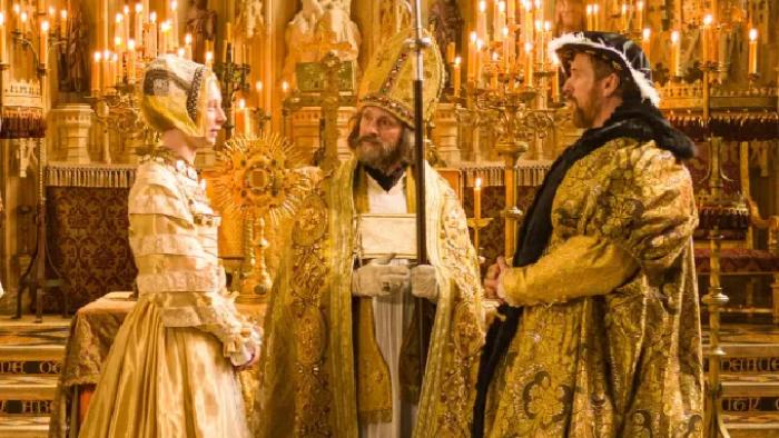 Wolf Hall: The Mirror & the Light TV show screenshot 3: King Henry VIII and Anne of Cleves face each other on an elaborate wedding altar. 