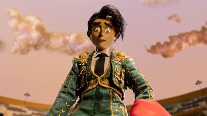 Women Wearing Shoulder Pads TV show screenshot 2: Espada, wearing her bullfighting costume, stands in a stadium gazing down at an unseen creature.