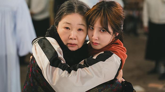 The Wonderfools TV show screenshot 1: "Trainwreck" and her grandmother embrace each other tightly, both looking toward the camera