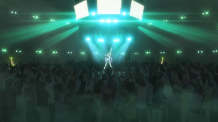 Ya Boy Kongming!: Eiko on stage performs for a large crowd, the stage and room filled with green and white light.