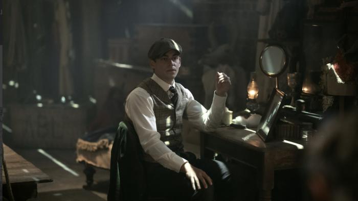 Young Sherlock TV show: Hero Fiennes Tiffin sits at a desk