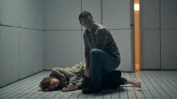 10x10: Luke Evans bends down over Kelly Reilly as she lies on the floor unconscious within a white padded cell