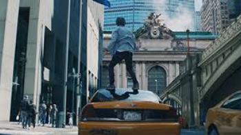 2:22: Dylan stands on a taxi