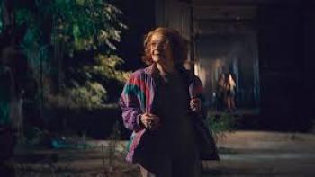 27 Nights Movie: Older woman walks outside