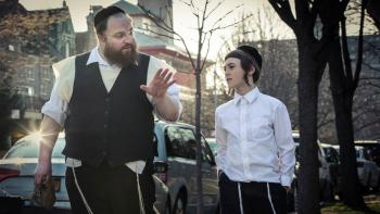 Menashe: An Orthodox Jewish man talking to his son