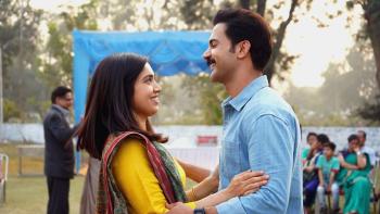Badhaai Do: An Indian woman and man smile at each other and get ready to embrace. 