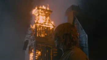 Harvest: A White man looks at a burning building