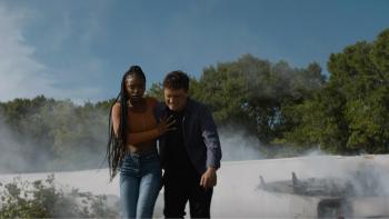 57 Seconds Movie: Lovie Simone helps Josh Hutcherson away from the debris of a plane crash