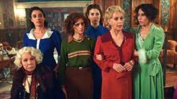 7 Women and a Murder movie: 6 white Italian women, 1 of them in wheelchair, talk to someone off camera