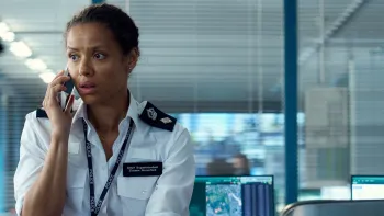 Fuze: A woman in a police chief superintendent uniform talks urgently on a mobile phone in a police control room