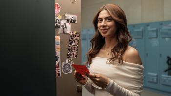 Nadaaniyan: A young Indian woman with long, wavy hair smiles while holding a red note in front of an open locker
