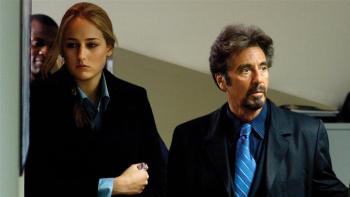 Alicia Witt and Al Pacino stand in a doorway.