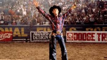 8 Seconds: Luke Perry accepts applause from the crowd