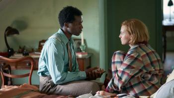 Mothering Sunday: Odessa Young and Sope Dirisu sitting on a bed