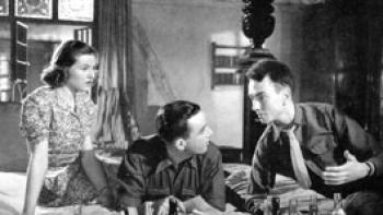 A Canterbury Tale: Sheila Sim, Dennis Price, and John Sweet sit on a bed together making plans