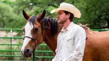 A Cowboy Christmas Romance: Adam Senn with a horse