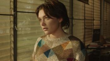 A Good Person Movie: The light shines on Florence Pugh as she looks out a window