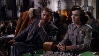 A Matter of Life and Death: Roger Livesey and Kim Hunter sit in a tea room, both looking at a character out of shot