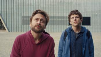 A Real Pain movie: Kieran Culkin and Jesse Eisenberg stare up at something