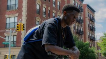 A Thousand and One Movie: Josiah Cross leans over while leaning on his bike