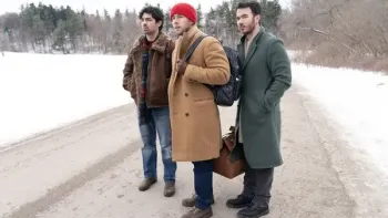 A Very Jonas Christmas Movie poster: The Jonas Brothers stand in winter clothes on a snow-covered road