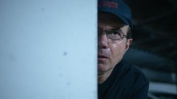 A Widow's Game: Tristan Ulloa peeks out from behind a column.