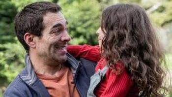 A Father's Miracle Movie: Hector holds Alma and smiles