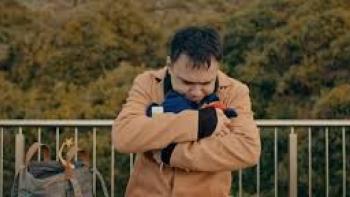 A Journey Movie: Asian man clutches himself