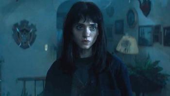 All Fun and Games Movie: In a dark house, Billie (Natalia Dyer) gazes steely eyed at something unseen