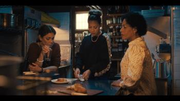 Allswell in New York movie: Daphne Rubin-Vega, Elizabeth Rodriguez, and Liza Colón-Zayas stand together at a table, looking concerned